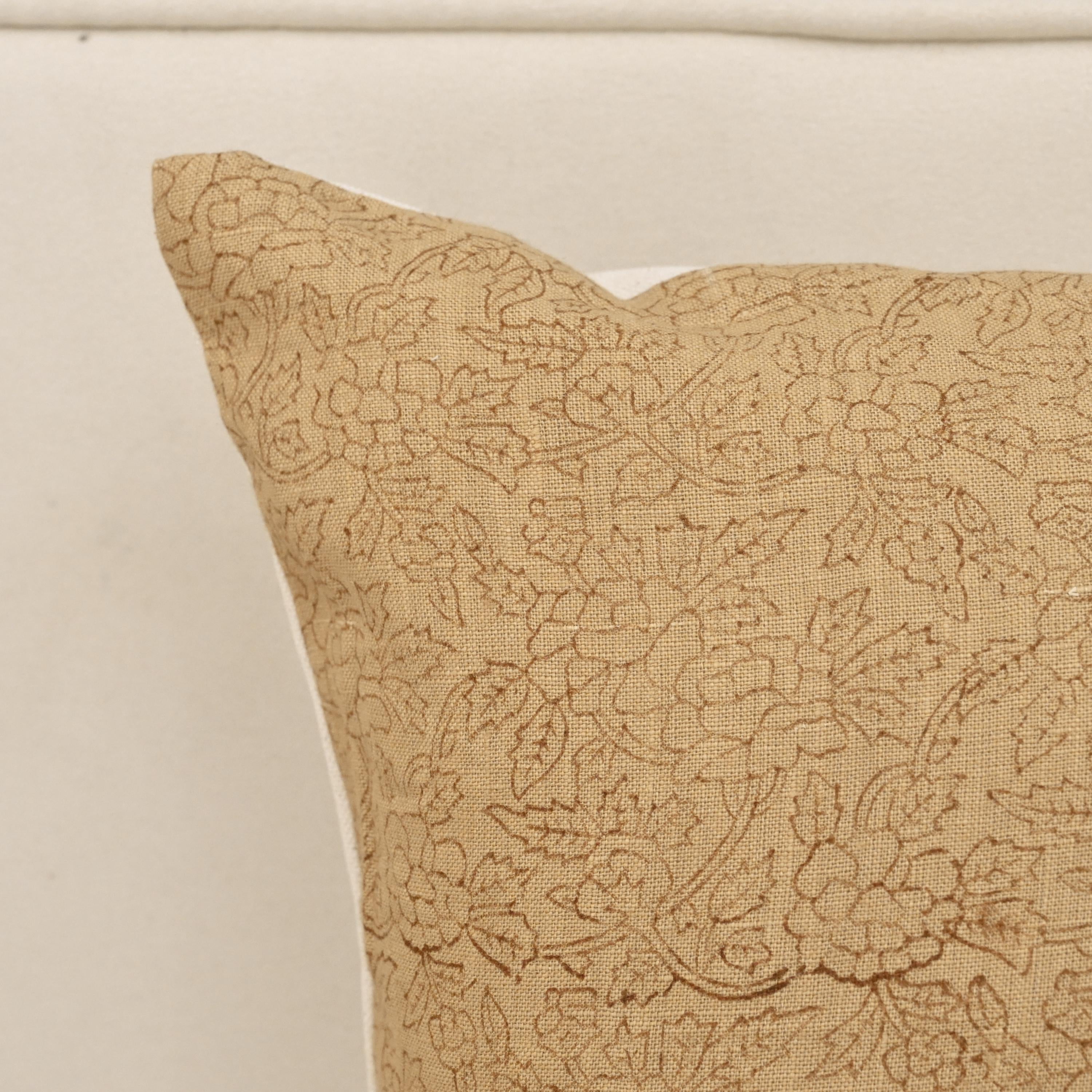 Ditsy floral vine linen pillow cover styled on a sofa