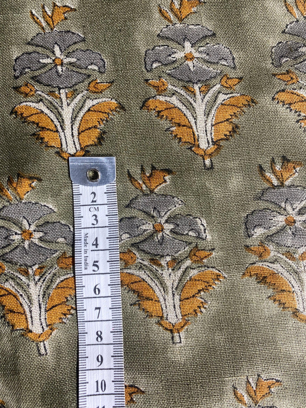 Sage green floral buti linen pillow cover, corner and zipper detail