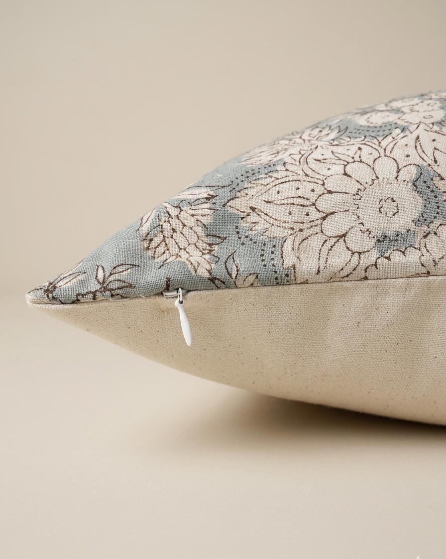 Close-up of blue-gray floral block print on linen pillow cover