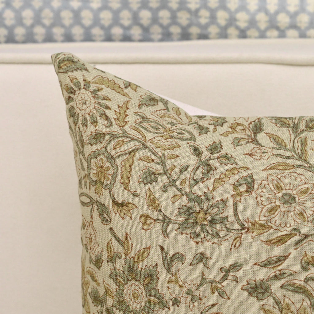 Sage rust jaal print linen pillow cover styled on a sofa