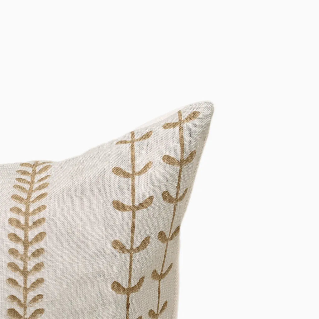 Corner detail of linen cushion cover showing olive green vine stripe block print