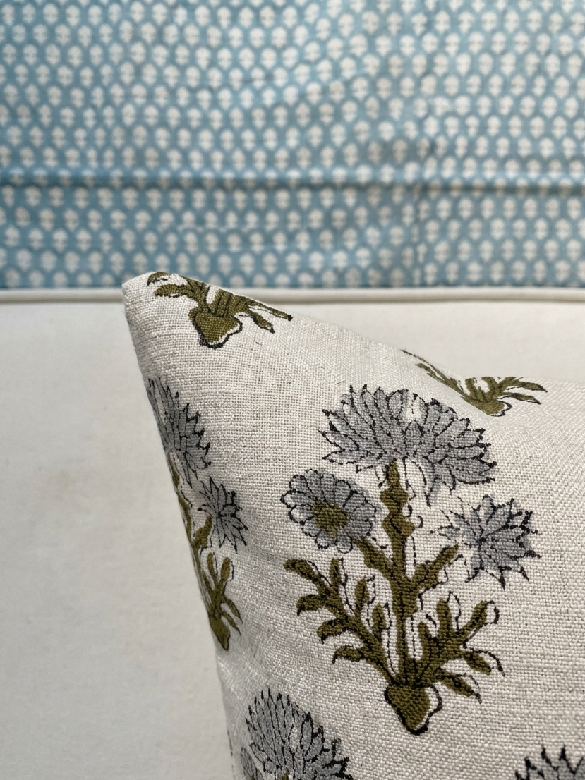 Close-up of pillow corner highlighting hand block print floral design on linen