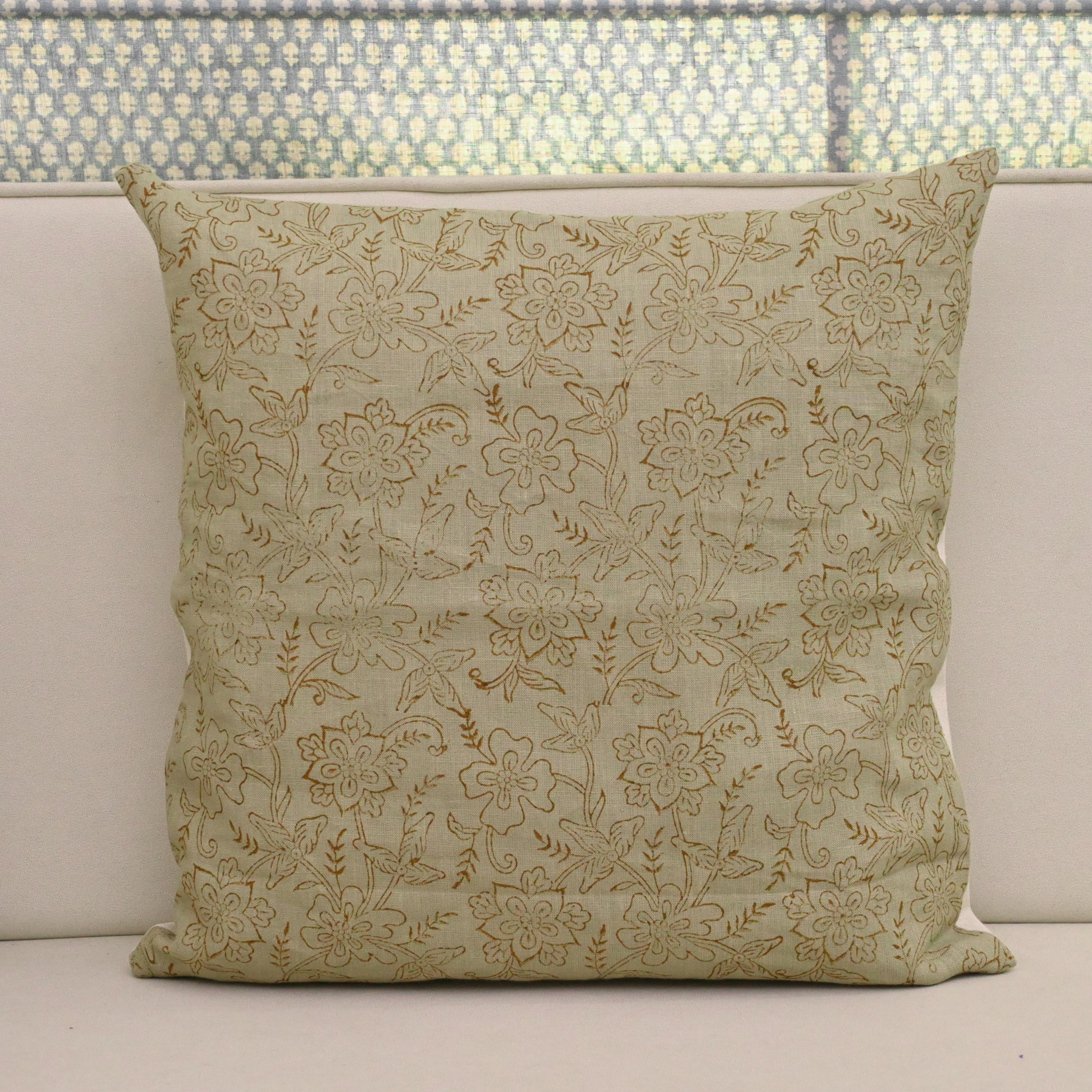 Sage green chintz jaal block print linen pillow cover styled on a sofa