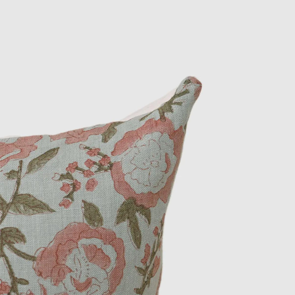Close-up of terracotta pink rose print on linen pillow cover