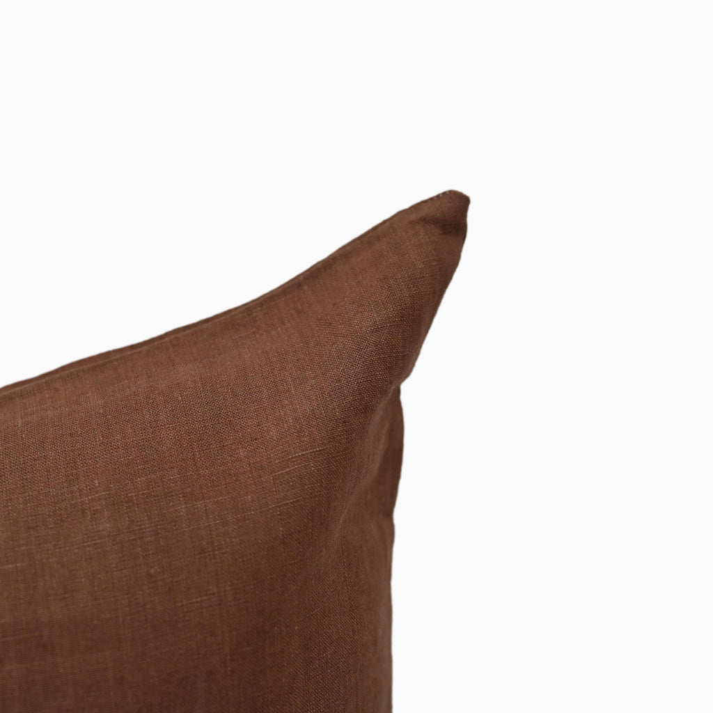 Solid brown linen pillow cover, corner and hidden zipper detail