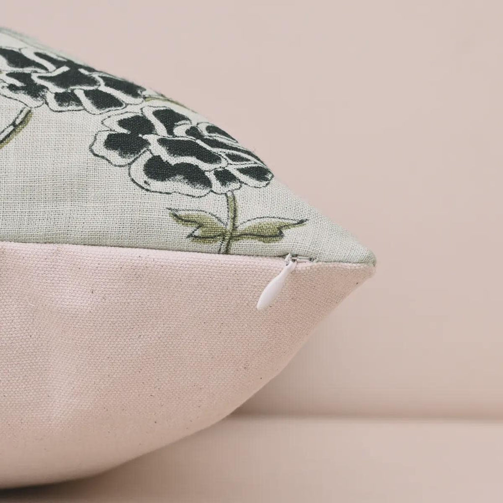 Hidden zipper and corner detail of charcoal floral linen pillow cover