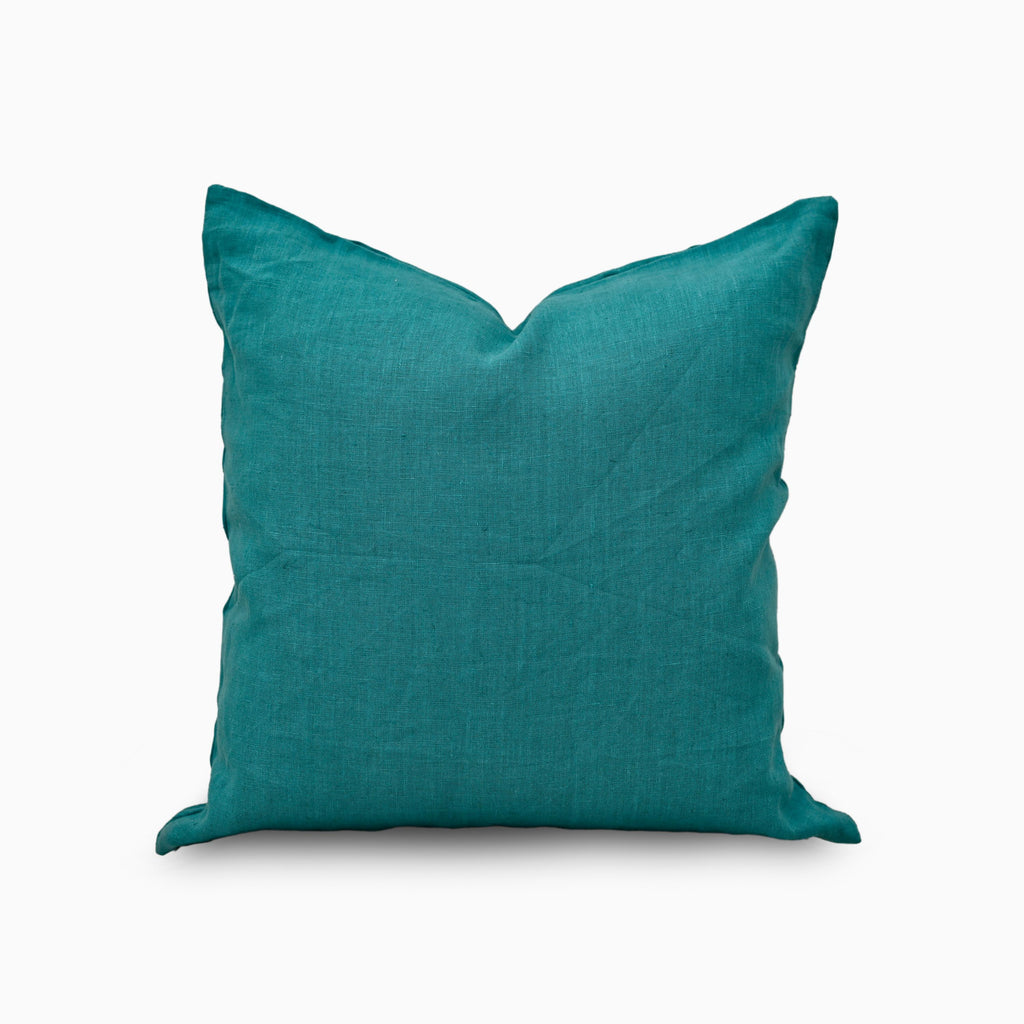 Deep teal solid linen pillow cover, front view on white background