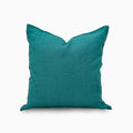Deep teal solid linen pillow cover, front view on white background