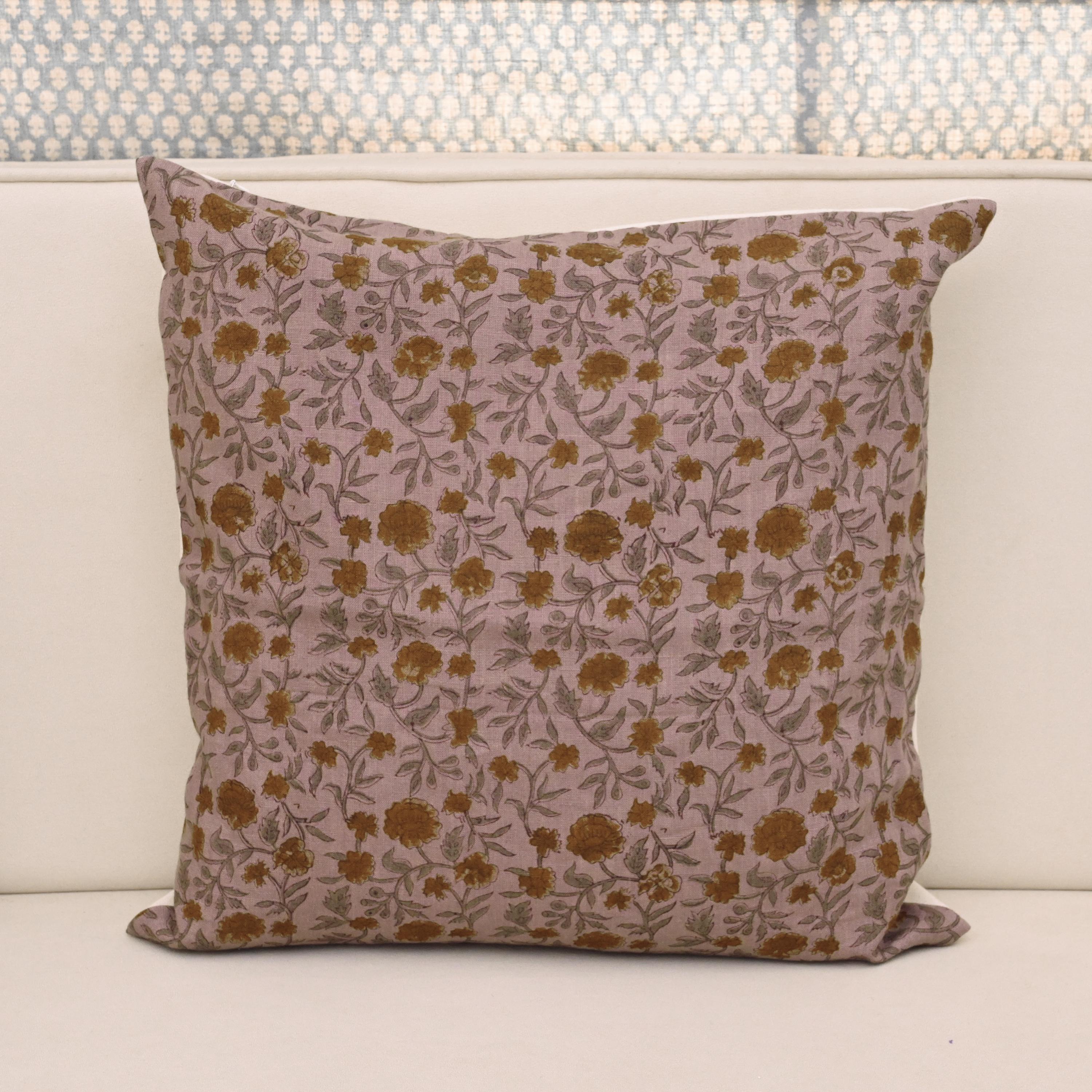 Dusty mauve linen pillow cover with hand block printed carnation trail in ochre gold and smoky sage, front view