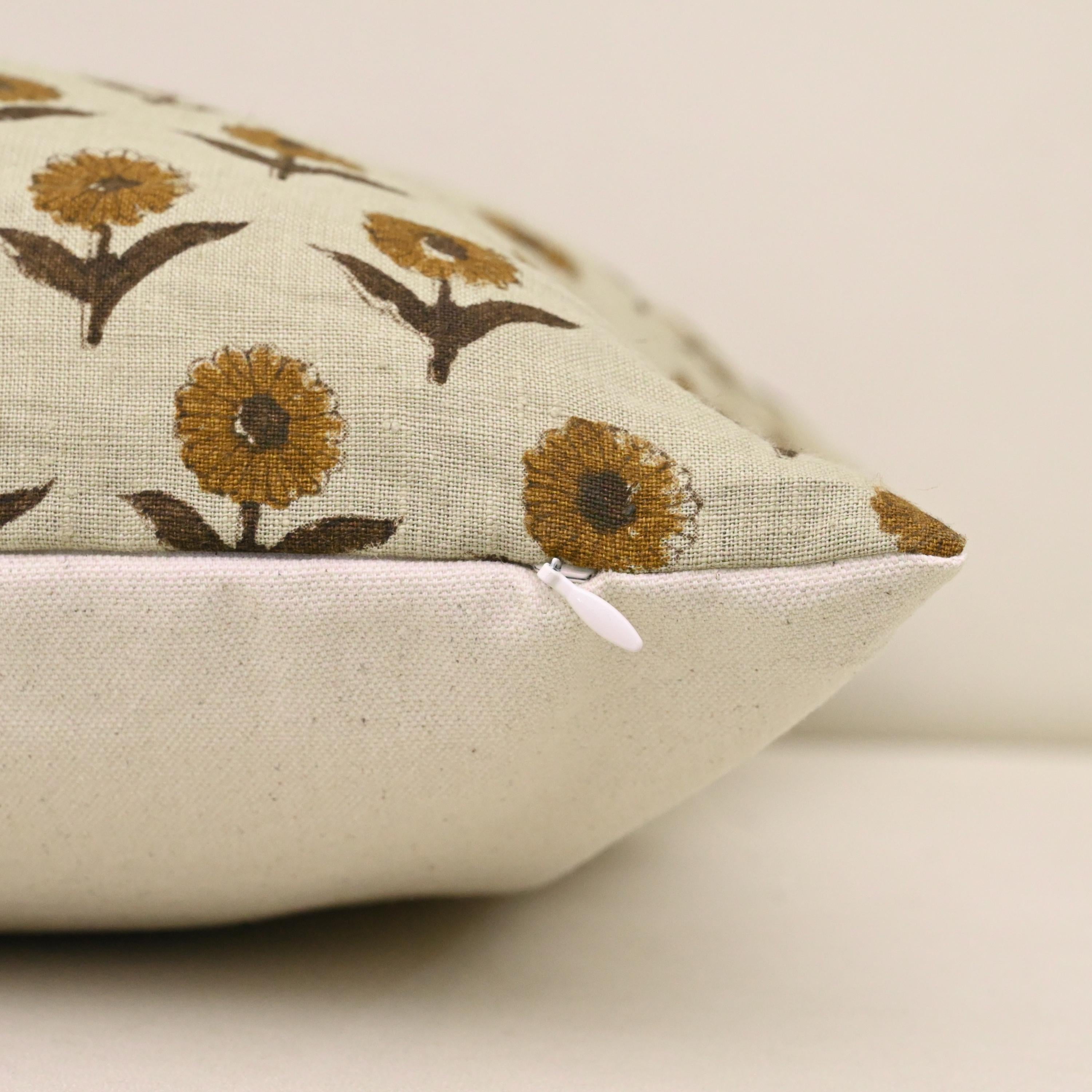 Close-up of the mustard floral hand block print on oatmeal linen