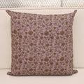 Dusty mauve linen pillow cover with hand block printed wild rose and hibiscus vine in charcoal and gold, front view