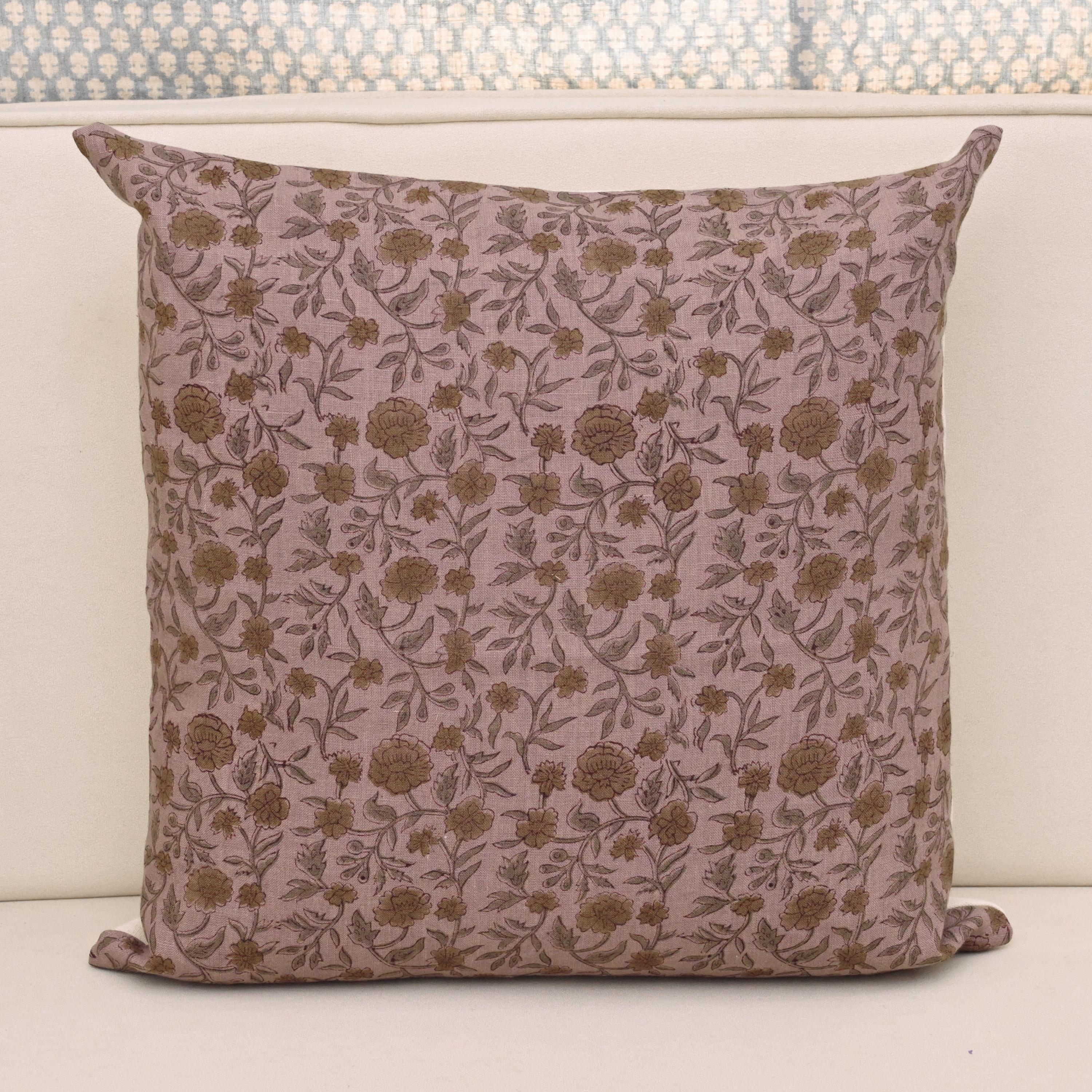 Dusty mauve linen pillow cover with hand block printed wild rose and hibiscus vine in charcoal and gold, front view