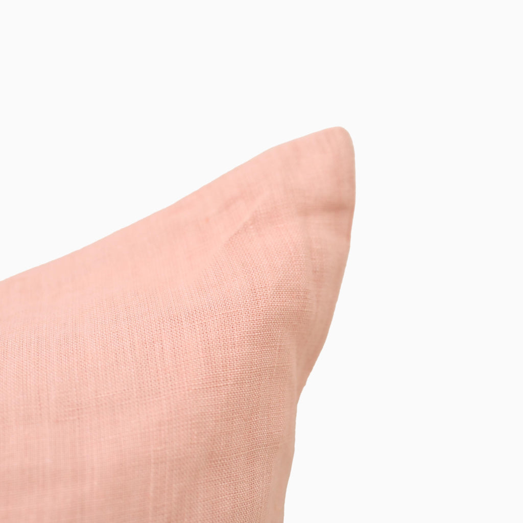 Close-up of blush pink linen pillow cover fabric weave and hidden zipper