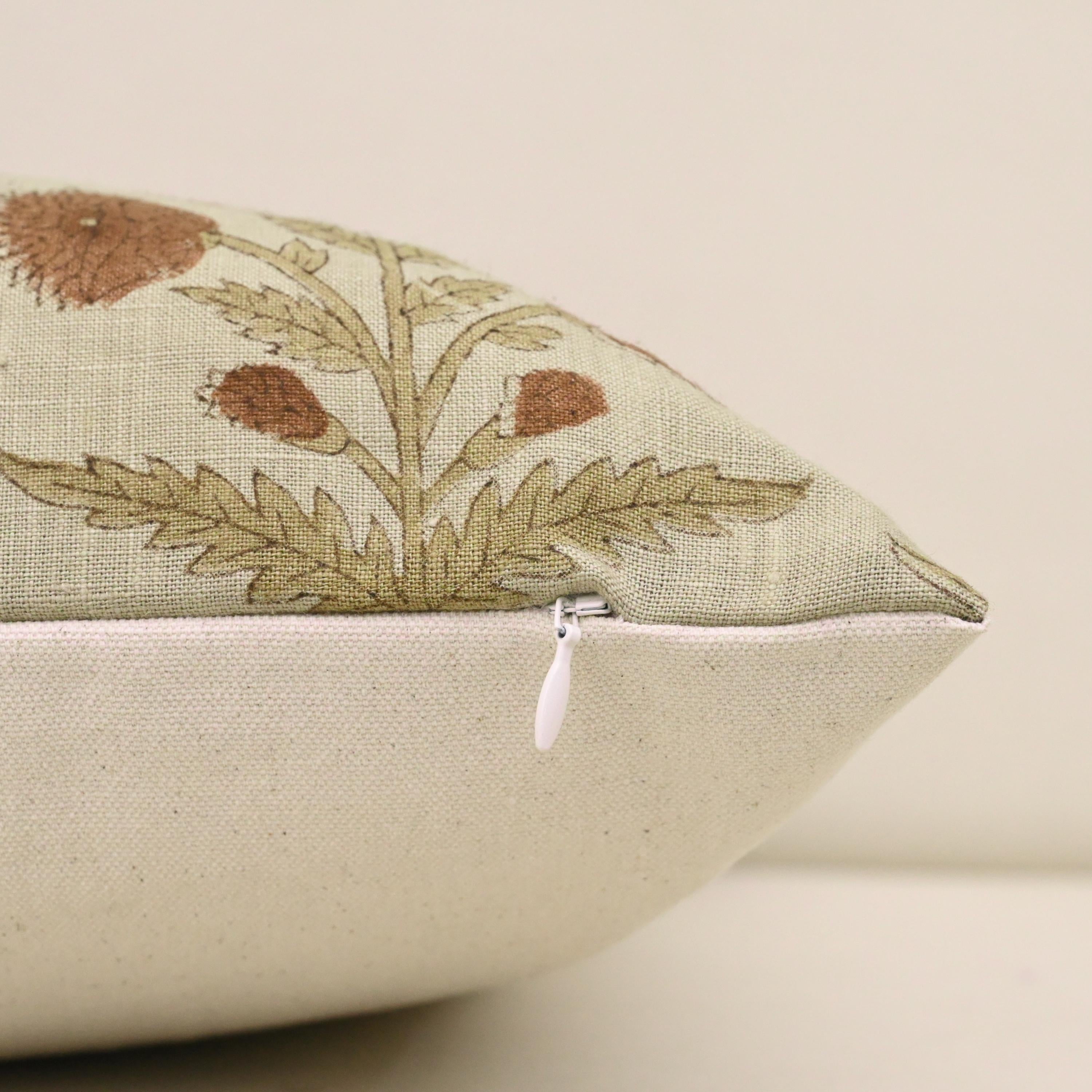 Close-up of rust dahlia floral block print detail on linen pillow cover