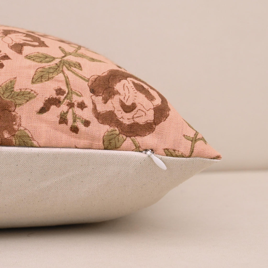 Close-up of the brown rose floral hand block print on pink linen
