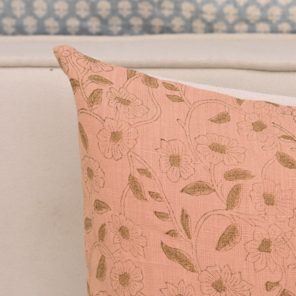 Close-up of golden rose floral block print detail on blush pink linen pillow cover