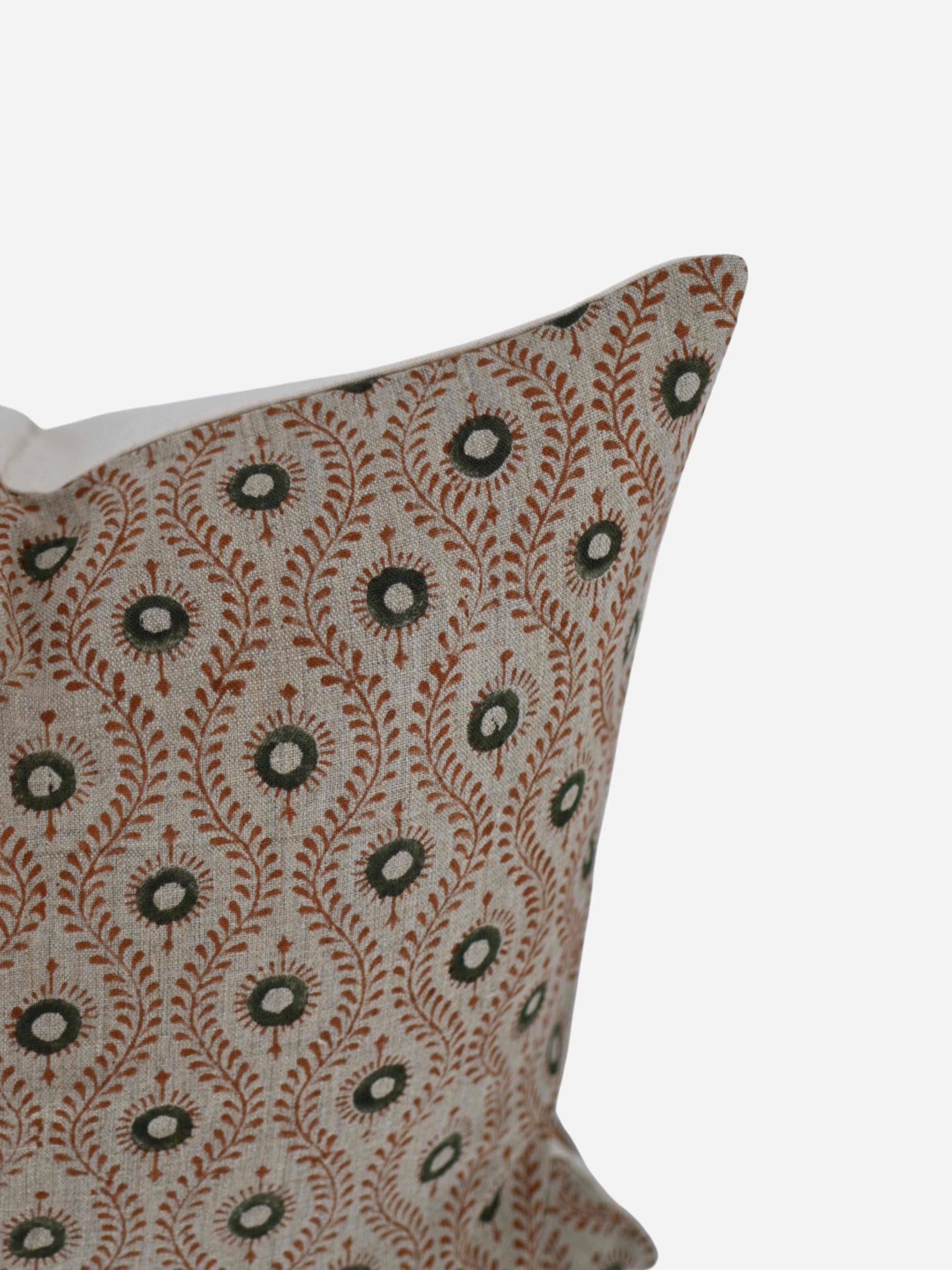 Close-up of the rust olive paisley ogee hand block print on natural linen