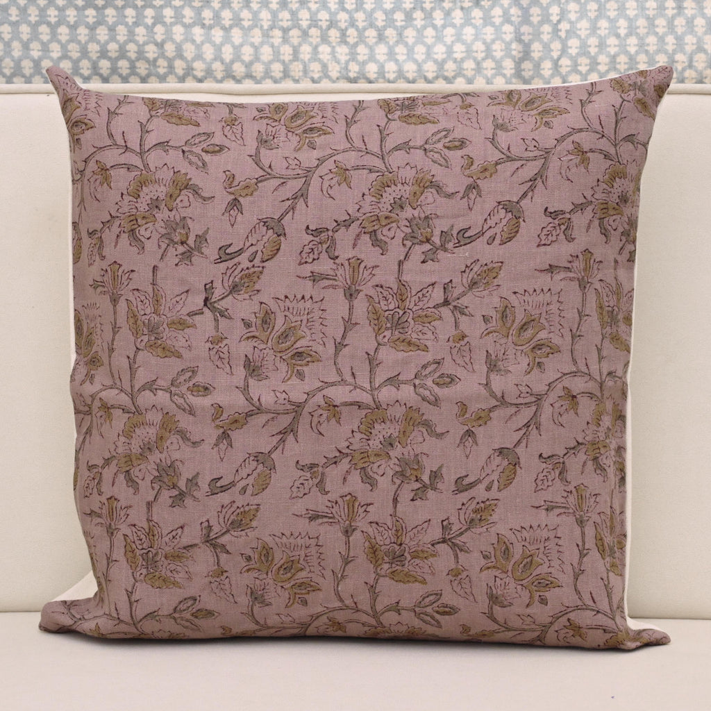 Muted gold floral hand block print linen pillow cover on dusty rose mauve background