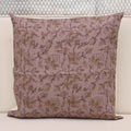 Muted gold floral hand block print linen pillow cover on dusty rose mauve background