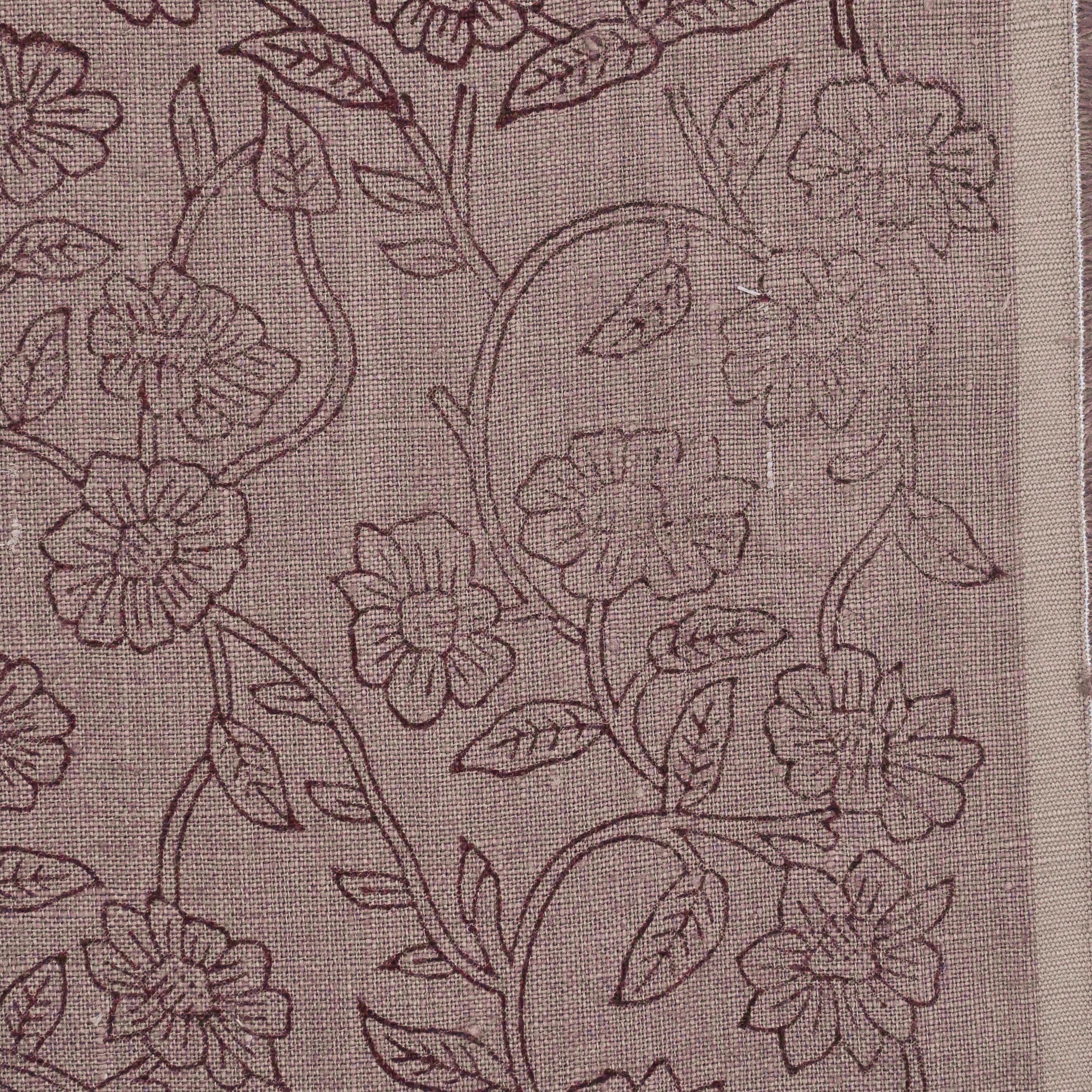 Close-up of the wine ditsy floral vine block print detail on mauve linen