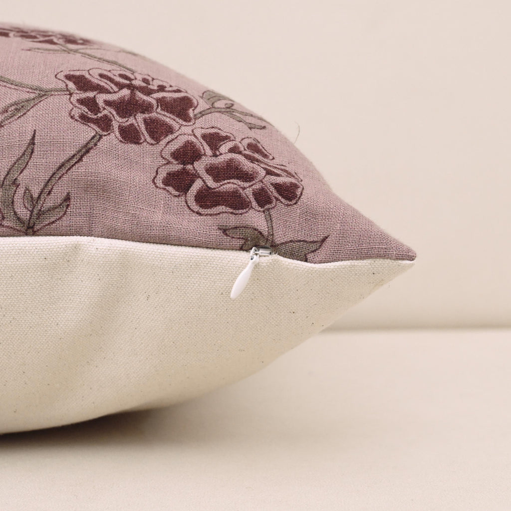 Corner and hidden zipper detail on mauve carnation linen pillow cover