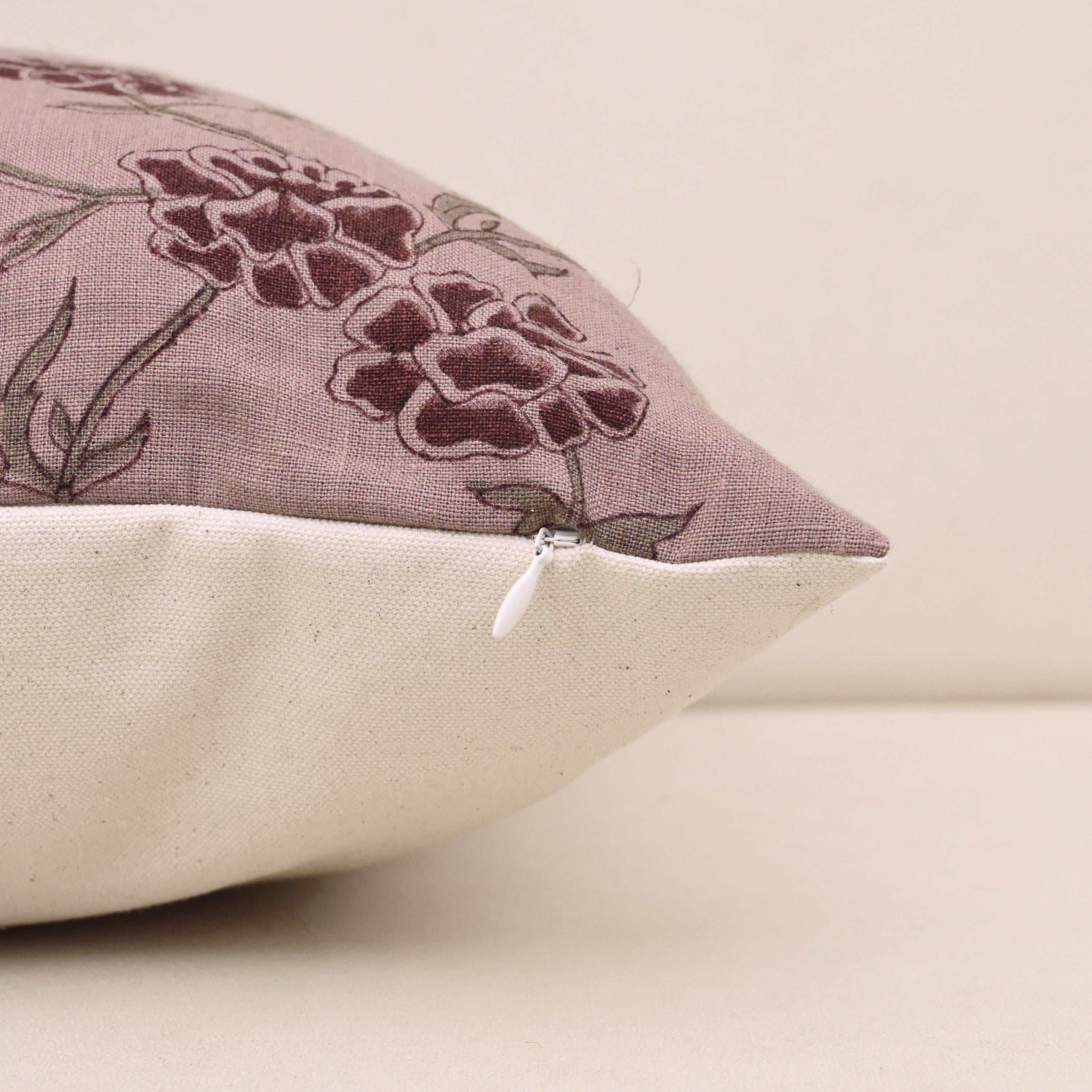 Corner and hidden zipper detail on mauve carnation linen pillow cover