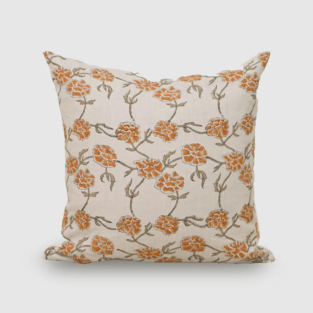 Marigold orange hand block print linen pillow cover on cream background