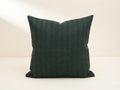 Forest green geometric stripe block print linen pillow cover on a sofa