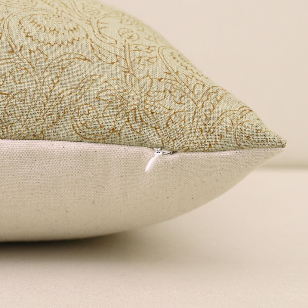 Corner detail of sage green chintz vine linen pillow cover