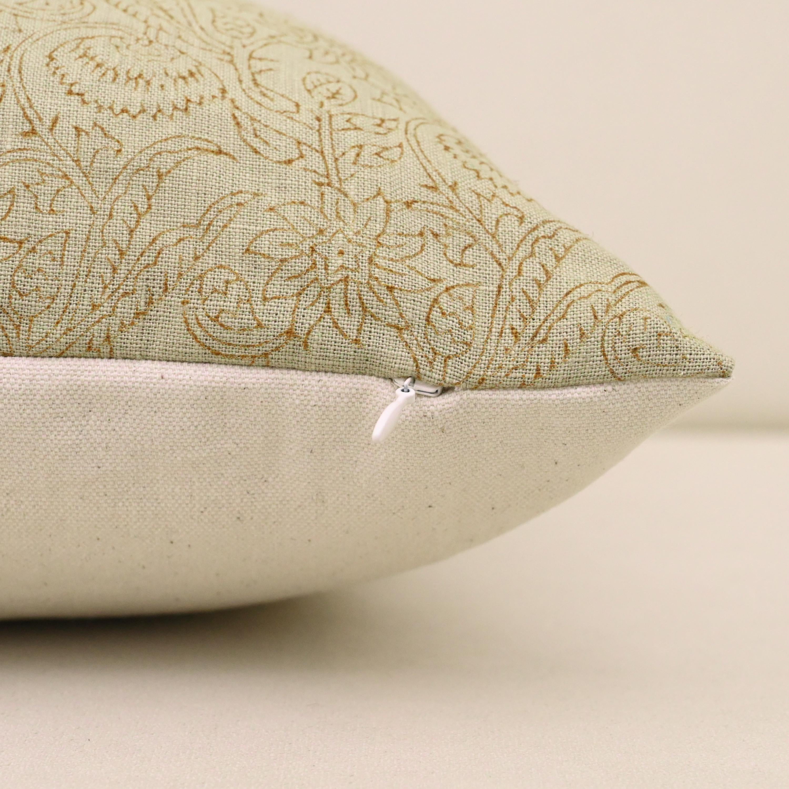 Corner detail of sage green chintz vine linen pillow cover