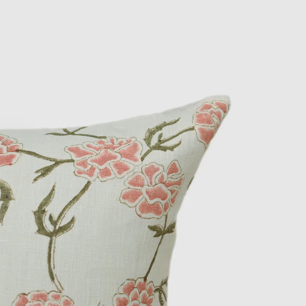 Close-up of blush pink floral vine print on ivory linen