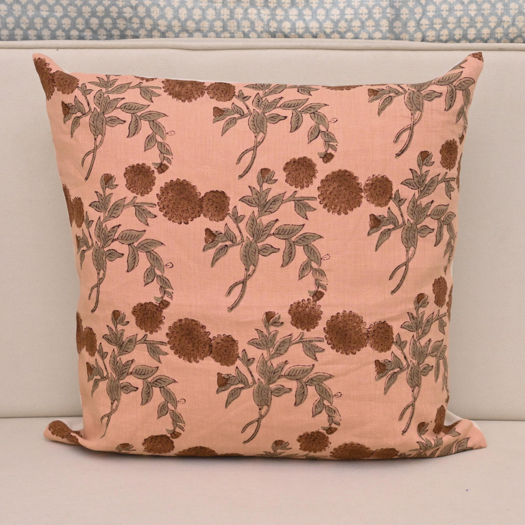 Rust brown pom-pom floral hand block print linen cushion cover on peach background