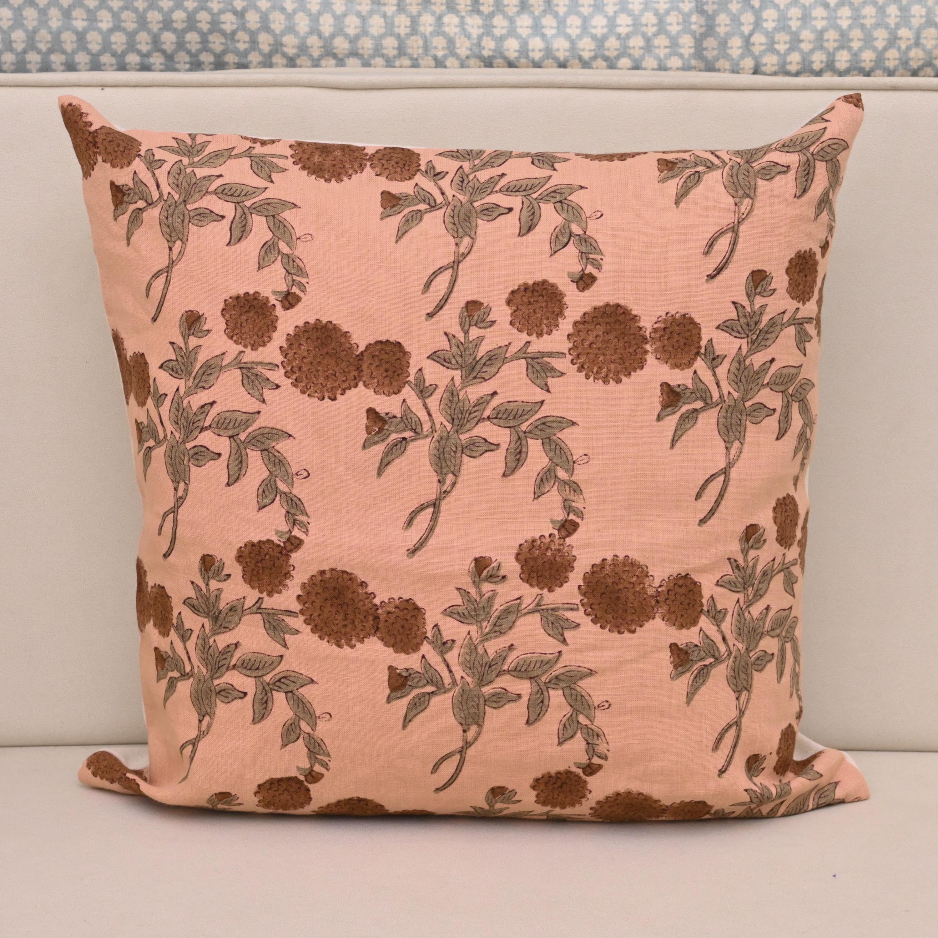 Rust brown pom-pom floral hand block print linen cushion cover on peach background