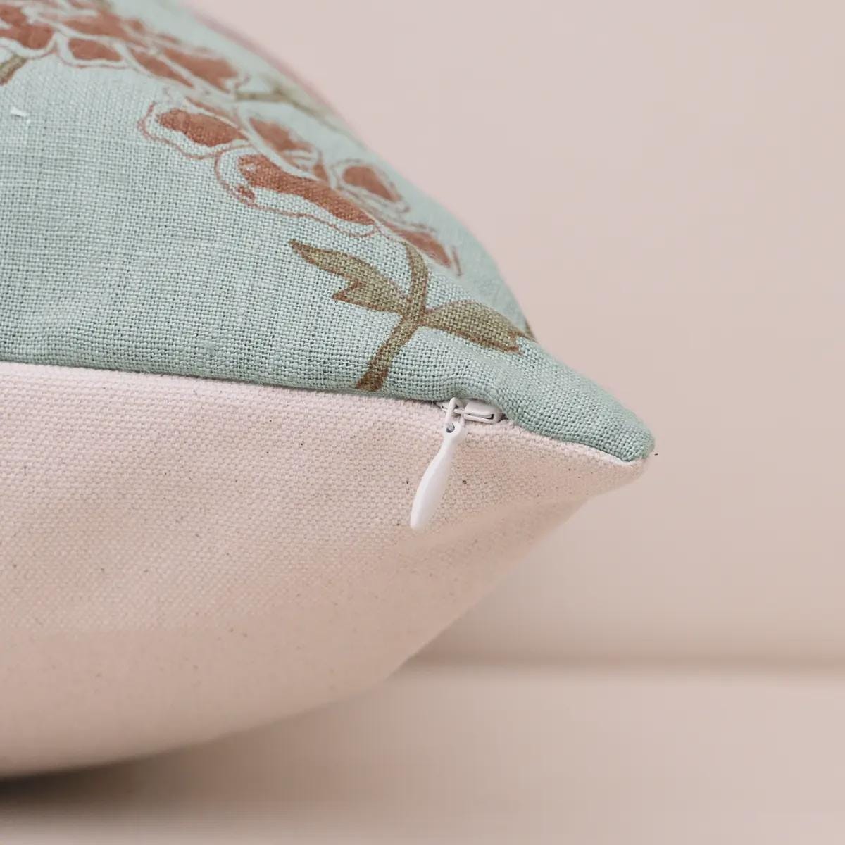 Zipper and corner detail of dusty blue botanical linen cushion cover