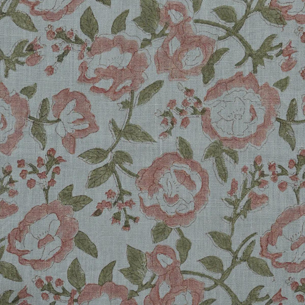 Terracotta pink rose block print linen pillow cover styled on a sofa