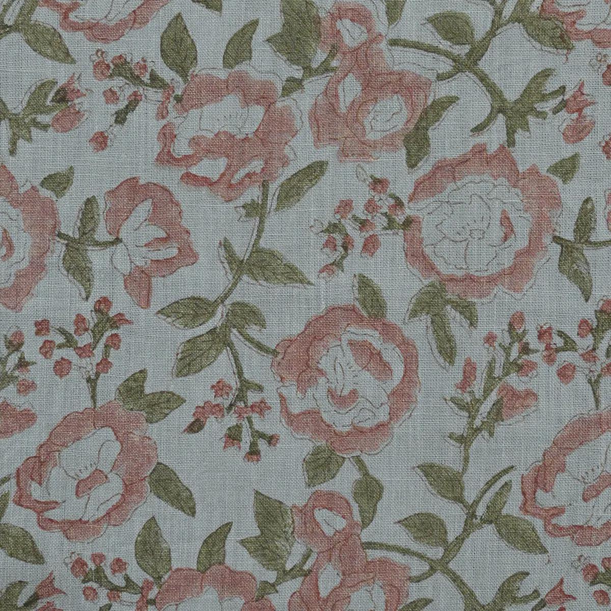 Terracotta pink rose block print linen pillow cover styled on a sofa