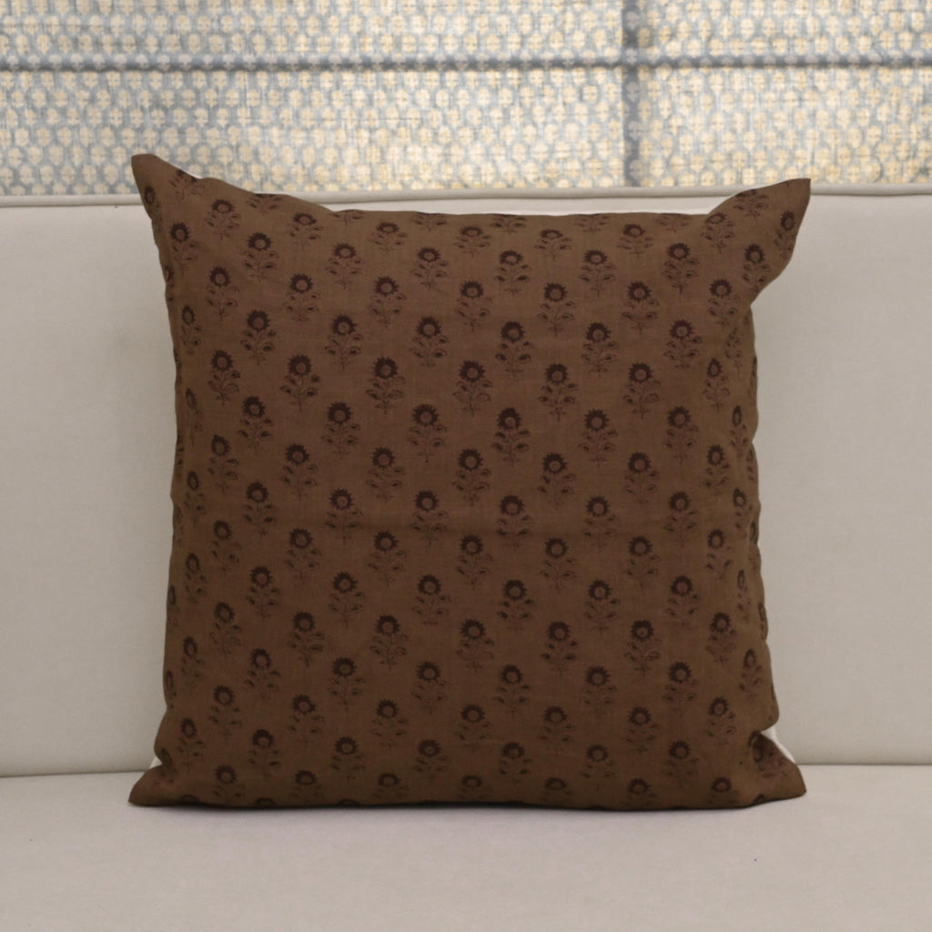 Boho floral buti block print linen pillow cover leaning against a headboard