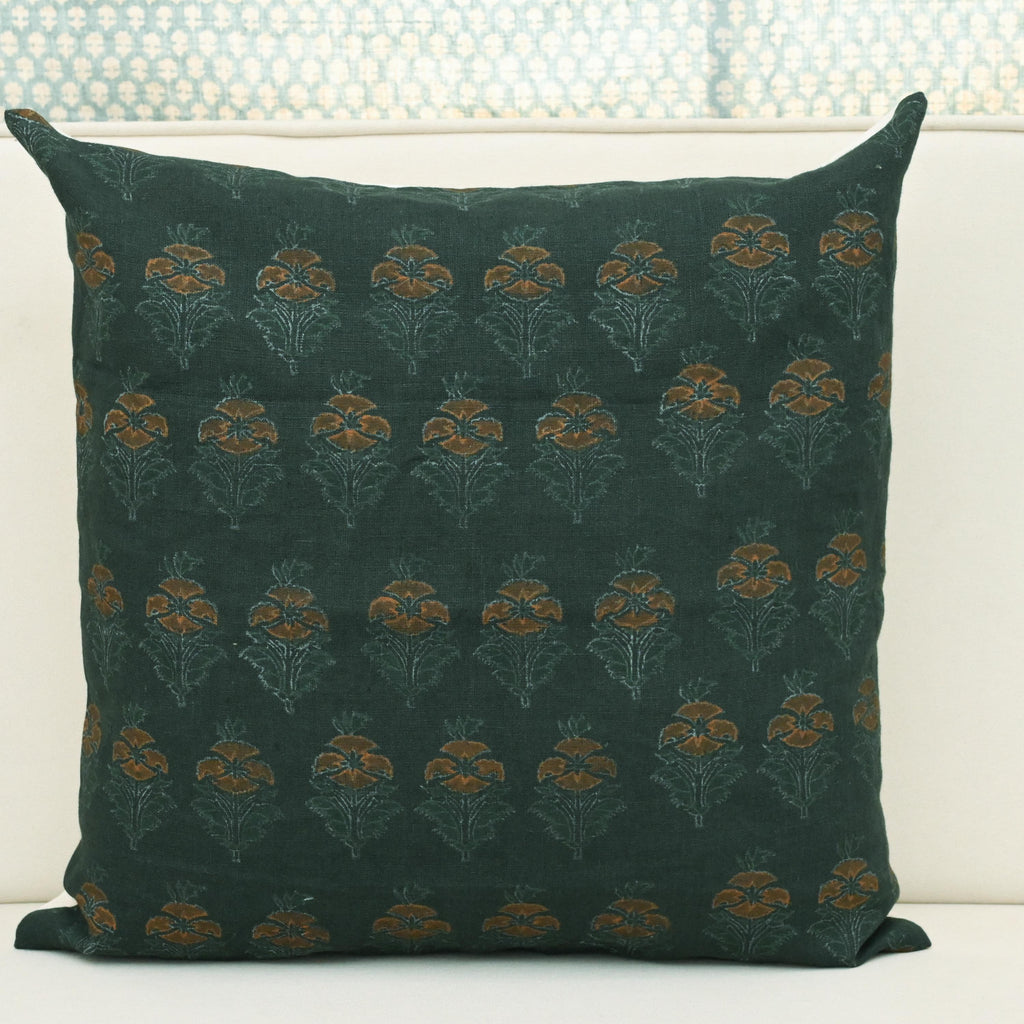 Forest green floral buti block print linen pillow cover styled on a sofa