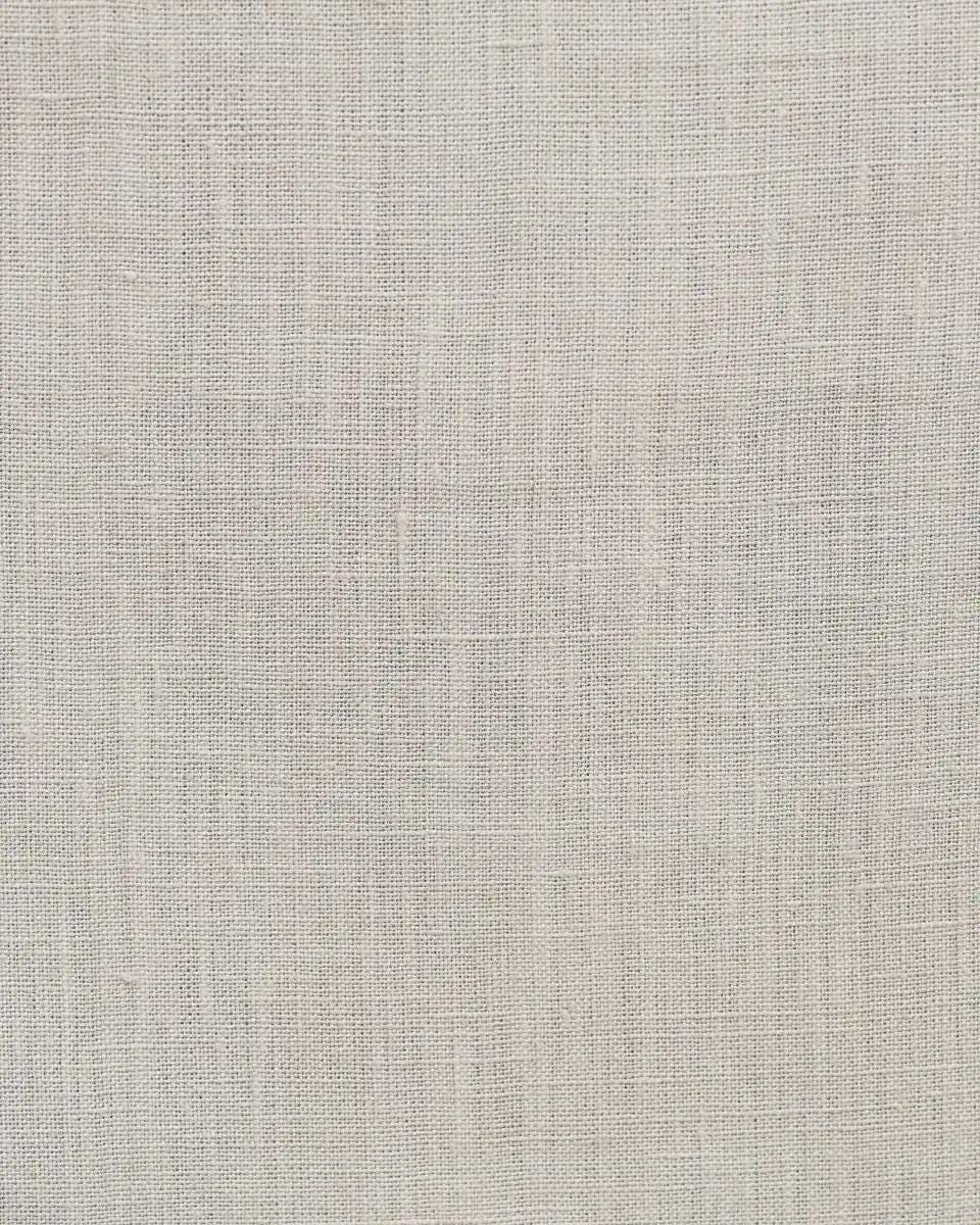 Close-up of light grey linen pillow cover weave and hidden zipper