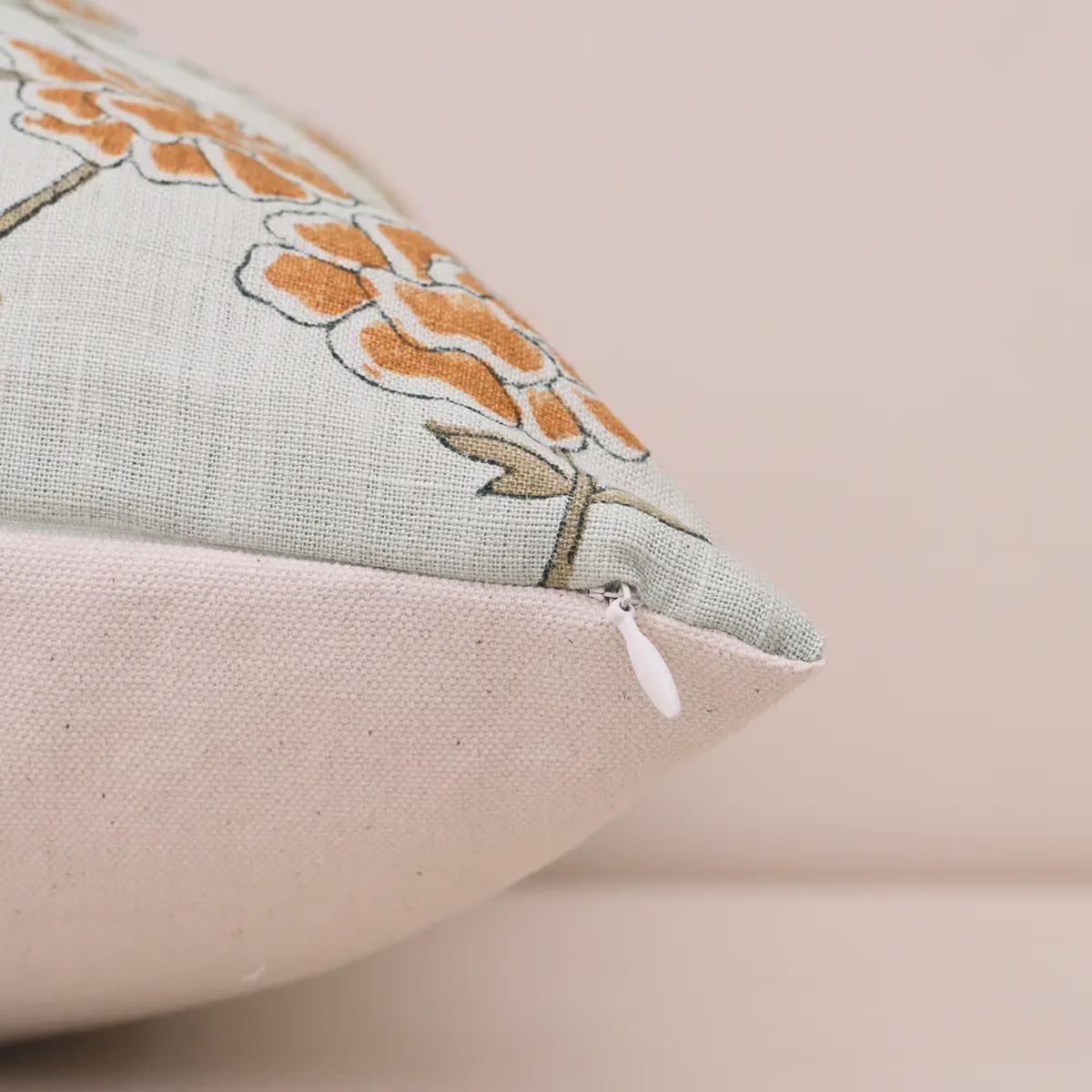 Corner and hidden zipper detail of marigold linen pillow cover